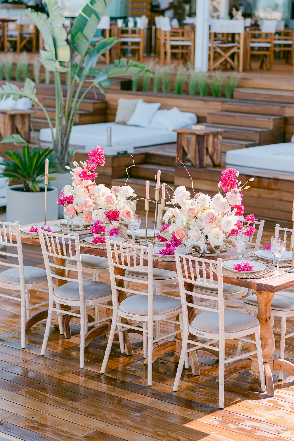 A table decorated with bright coloured flowers