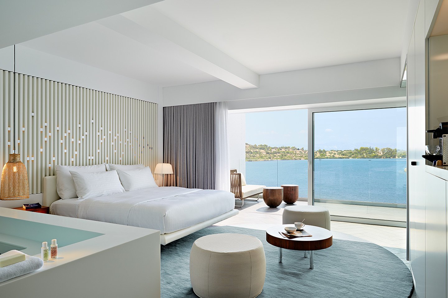 signature suite bedroom leading to private sea view balcony