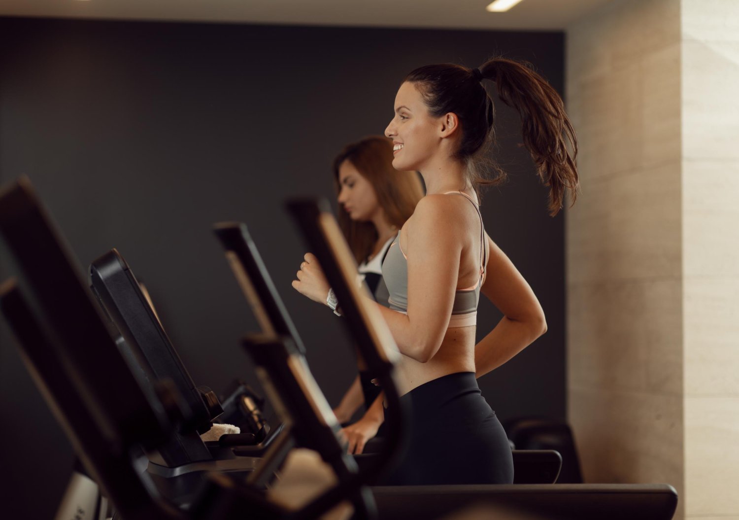 Women running on treadmills