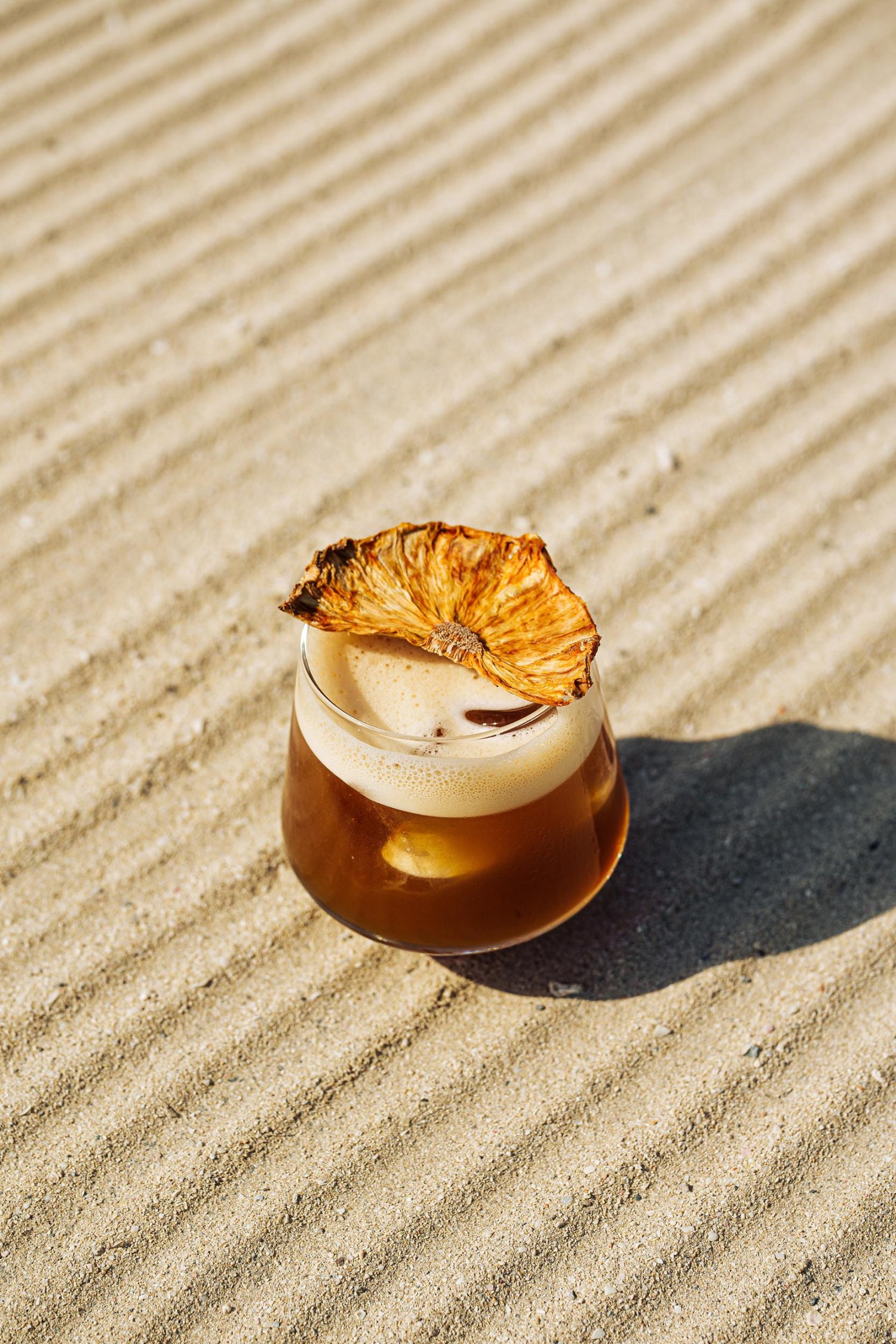 Oman Bahama Mama cocktail with dried orange garnish