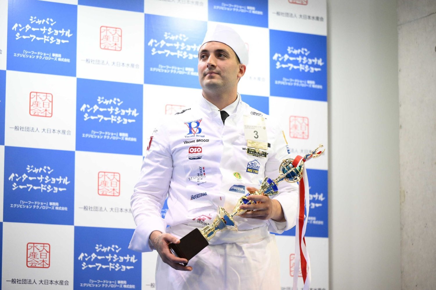 Chef Vincent Broggi holding an award