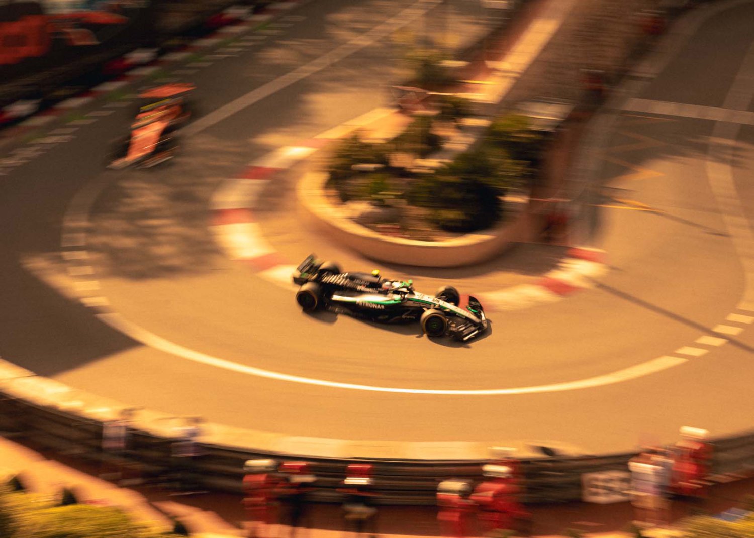 Formula one car going round a bend on the track