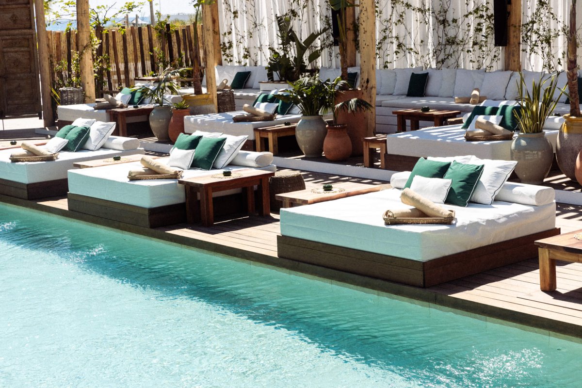 Sun loungers at the side of the pool