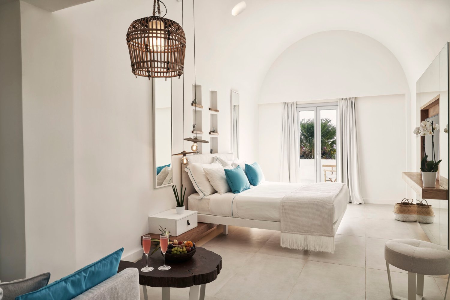 Signature Room with Sea View, double bed with doors onto patio area