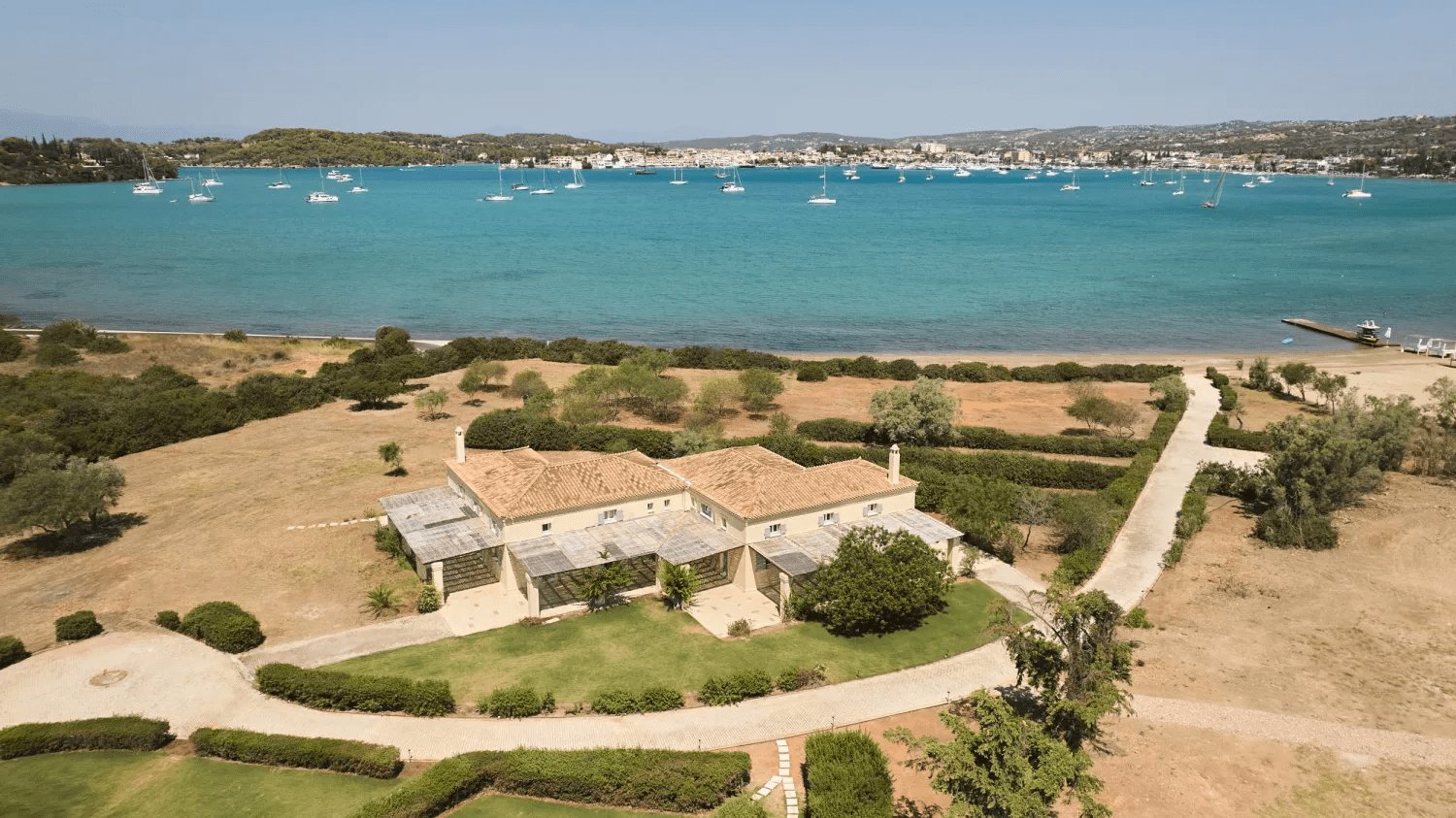 Elevated view of a tranquil one-bedroom bungalow by the water, offering a peaceful retreat in nature's embrace