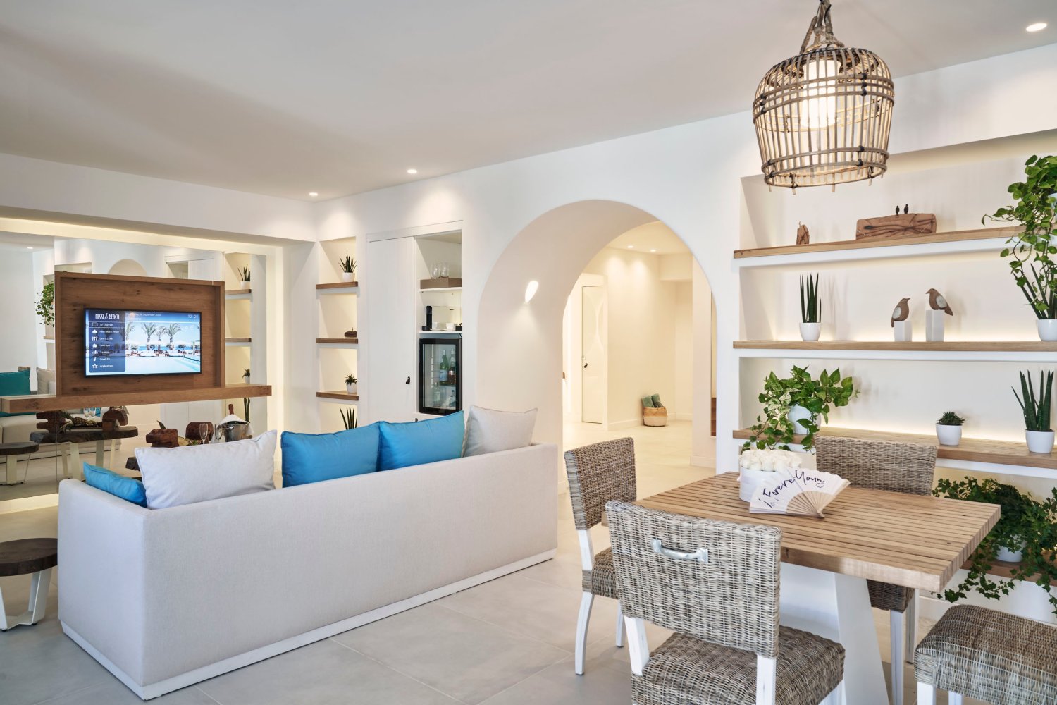 Ultra Suite with Private Pool & Patio, lounge area with sofas, tv, small dining table and beer fridge