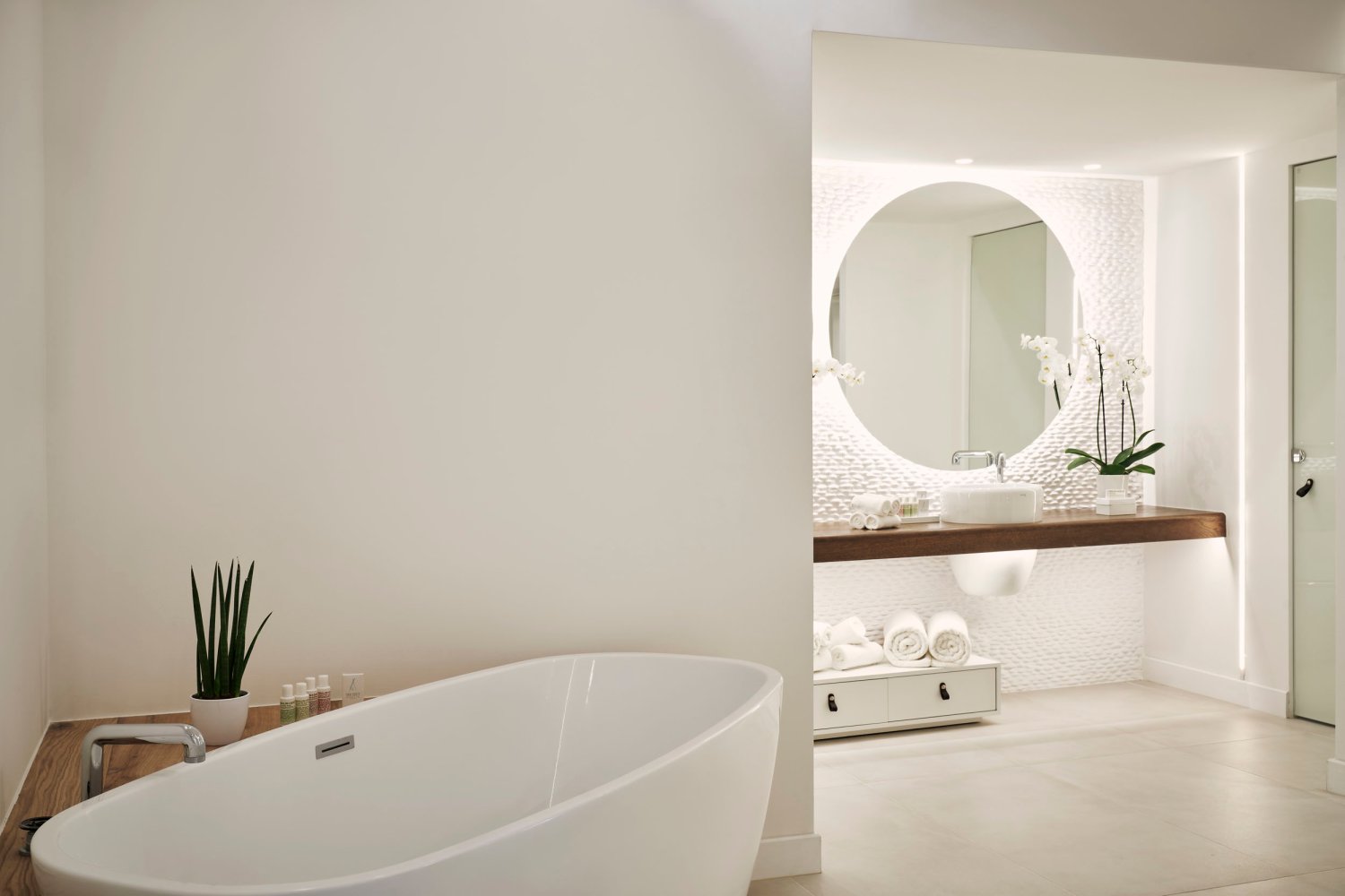 Ultra Suite with Private Pool & Patio, bathroom area with bath tub, basin and mirror