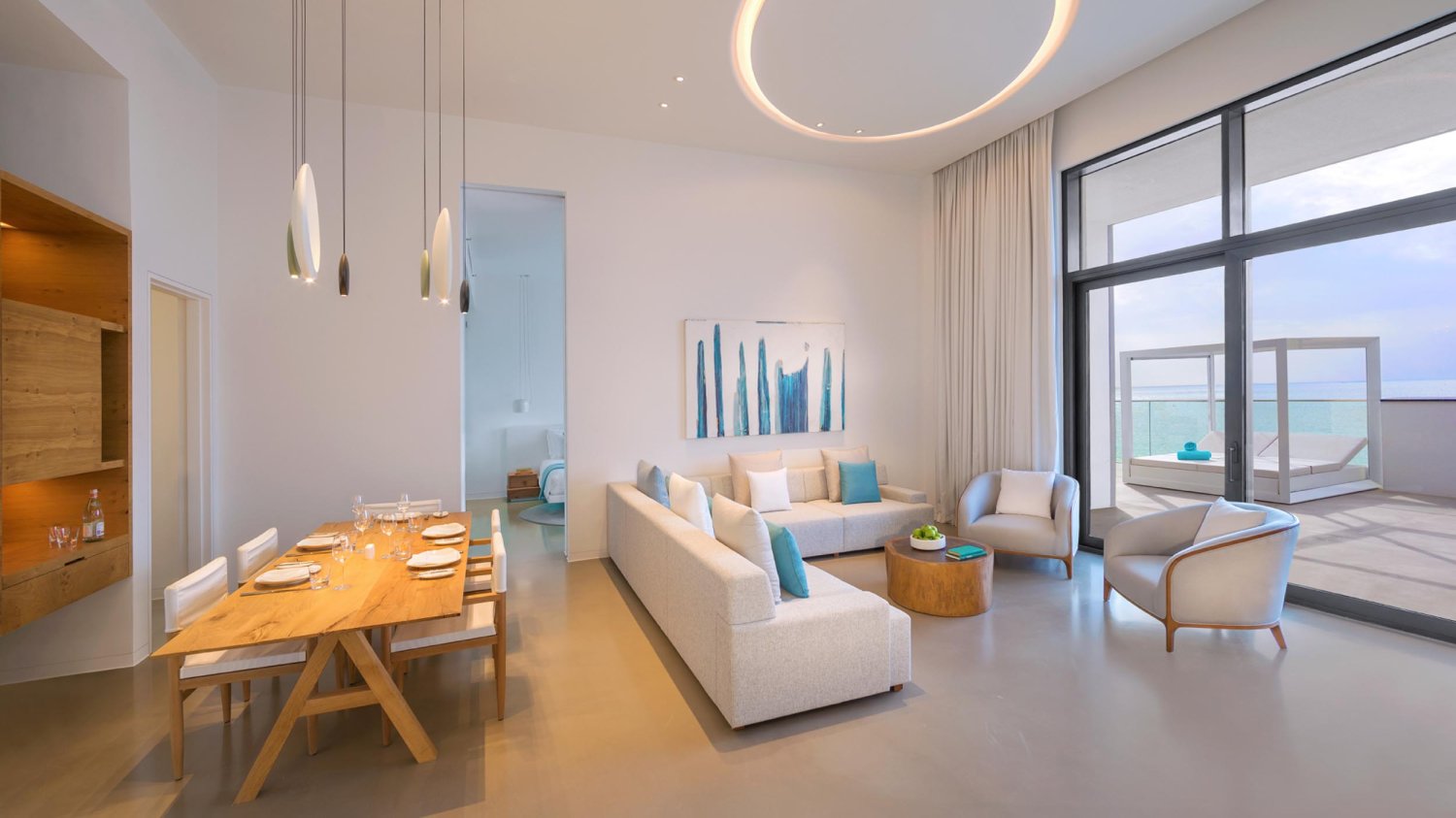 L shaped sofa, arm chairs and dining table area