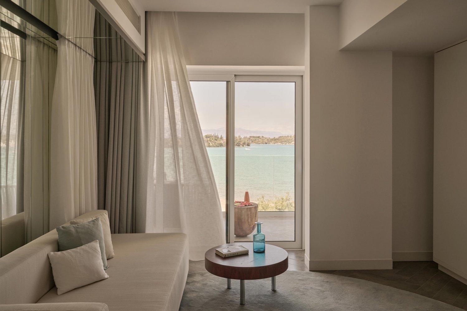 Breathtaking view of the sea from a hotel bedroom, embodying the elegance and relaxation of Nikki Beach Porto Heli