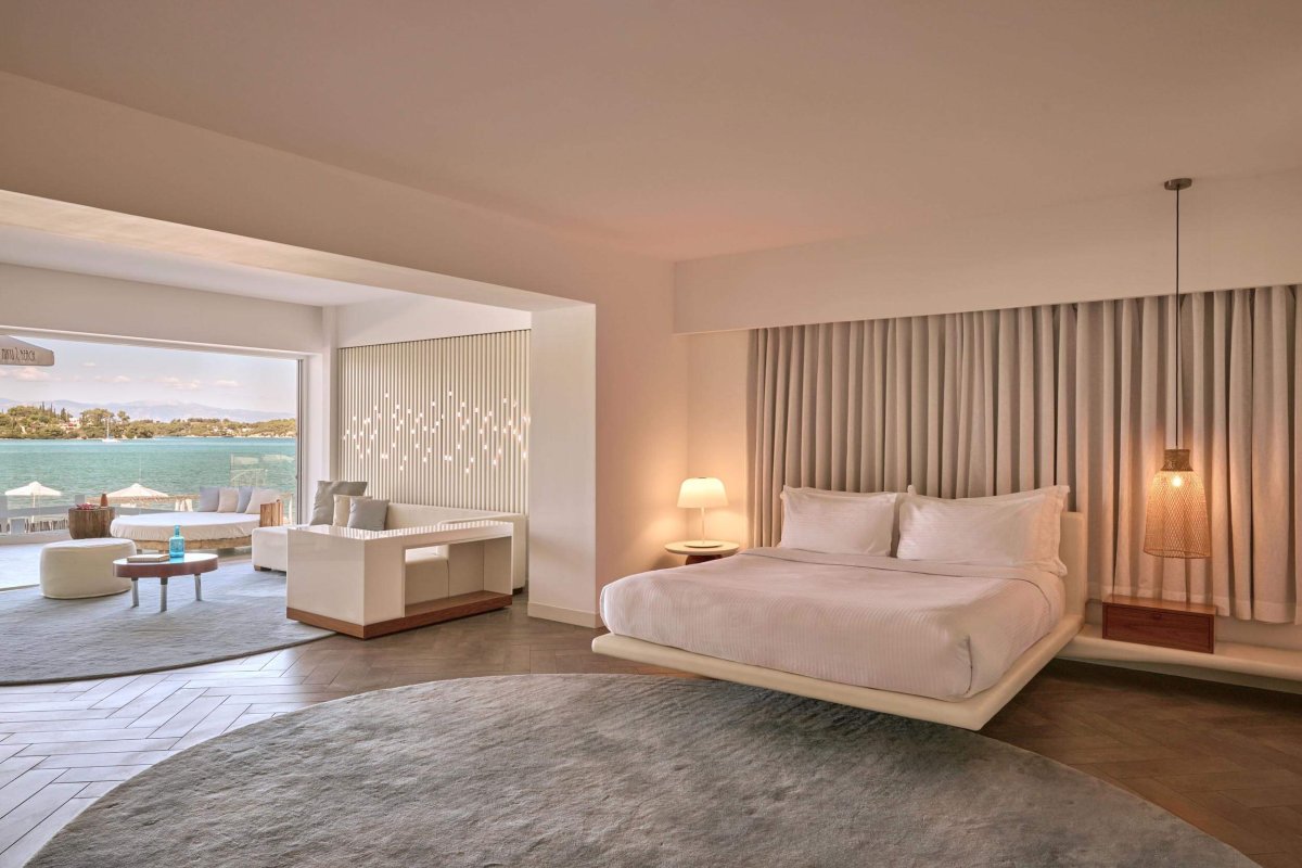 Double bed room with lounge area and sun bed on the balcony