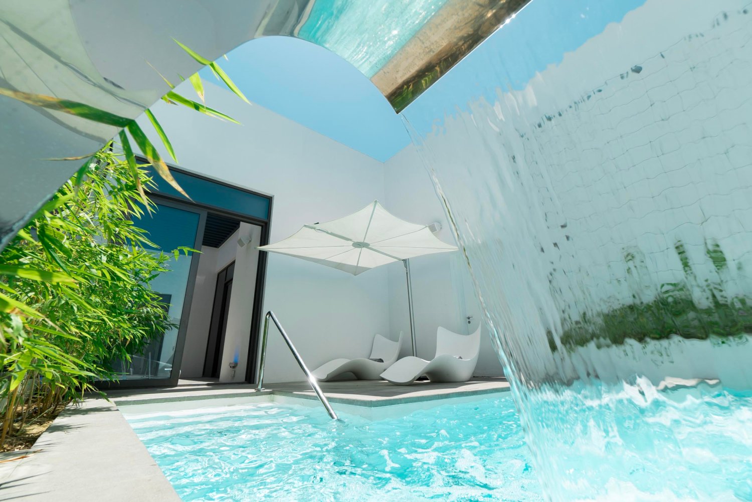 Vitality pool with water and sun loungers