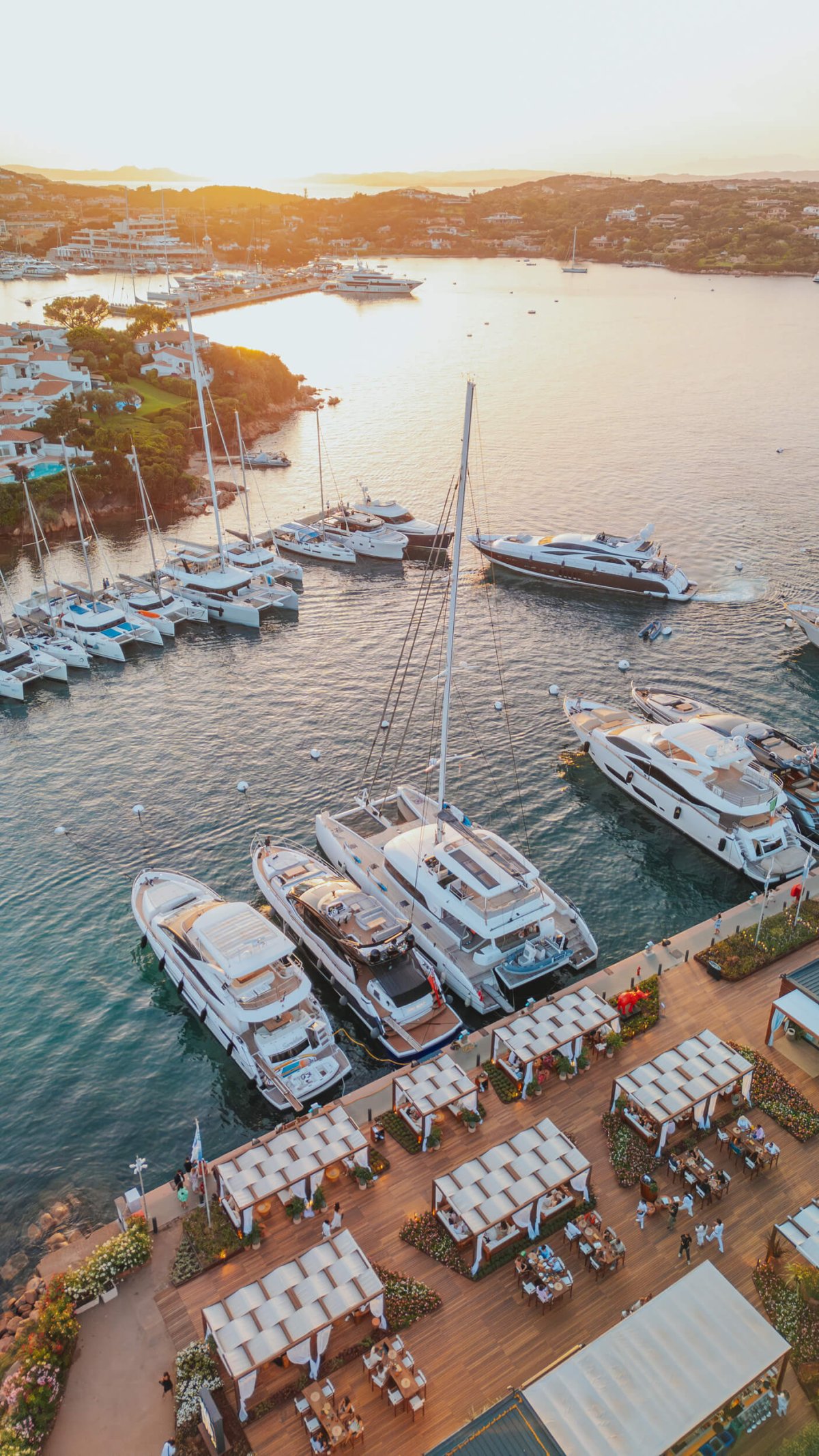 Drone shot of the dock at Porto Cervo at sunset